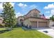 Inviting two-story home with a three-car garage and well-maintained landscaping at 741 Wildwood Beach Ave, Henderson, NV 89052