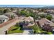 Inviting two-story home boasts a manicured lawn, mature trees, and a two-car garage in a vibrant neighborhood at 741 Wildwood Beach Ave, Henderson, NV 89052
