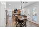 Charming kitchen and dining area featuring wood floors, stainless steel appliances, and a view of the pool, perfect for gatherings at 741 Wildwood Beach Ave, Henderson, NV 89052
