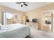 Comfortable bedroom with a ceiling fan and sliding door access to an outdoor terrace at 7450 S Eastern Ave # 1058, Las Vegas, NV 89123