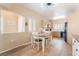 Charming dining area adjacent to kitchen featuring stylish table and chairs and tile flooring at 7450 S Eastern Ave # 1058, Las Vegas, NV 89123
