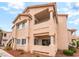 Exterior view of a condo building showing the balcony, and architectural details at 7450 S Eastern Ave # 1058, Las Vegas, NV 89123