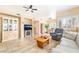 Spacious living area features neutral decor, fireplace, tile floors, and lots of natural light at 7450 S Eastern Ave # 1058, Las Vegas, NV 89123