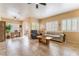 Bright and spacious living area with tile floors, large windows, and sliding glass door to patio at 7450 S Eastern Ave # 1058, Las Vegas, NV 89123