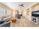 Bright living room with tile floors, fireplace, and neutral decor offers comfortable and stylish living at 7450 S Eastern Ave # 1058, Las Vegas, NV 89123