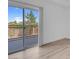 Bedroom with sliding glass doors and balcony featuring a view at 75 E Agate Ave # 206, Las Vegas, NV 89123