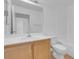 Clean bathroom with wood vanity, white sink, toilet and shower/tub combo at 75 E Agate Ave # 206, Las Vegas, NV 89123