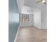 Bright bedroom featuring light floors and a window overlooking palm trees at 75 E Agate Ave # 206, Las Vegas, NV 89123