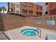 Relax in the community hot tub surrounded by privacy walls and landscaping at 75 E Agate Ave # 206, Las Vegas, NV 89123