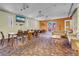 A spacious lounge featuring a long wooden table, leather couches, stylish lighting, and decorative elements at 75 E Agate Ave # 206, Las Vegas, NV 89123