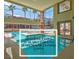 Beautiful community pool with palm trees and large windows for a relaxing atmosphere at 75 E Agate Ave # 206, Las Vegas, NV 89123