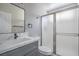 Bathroom featuring a stylish sink, toilet, and a sleek shower with frosted doors at 7619 Comanche Canyon Ave, Las Vegas, NV 89113