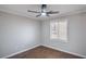 Neat bedroom showing fan, natural light, and hardwood floors at 7619 Comanche Canyon Ave, Las Vegas, NV 89113