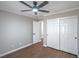 Bedroom with a ceiling fan, closet, and neutral wall paint at 7619 Comanche Canyon Ave, Las Vegas, NV 89113