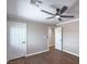 Bedroom featuring neutral walls, modern ceiling fan, and contrasting trim work at 7619 Comanche Canyon Ave, Las Vegas, NV 89113