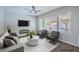 Cozy living room featuring ample natural light and neutral-toned decor at 7619 Comanche Canyon Ave, Las Vegas, NV 89113