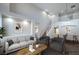 Bright, open-concept living room boasts high ceilings and an adjacent staircase at 7619 Comanche Canyon Ave, Las Vegas, NV 89113
