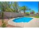 Backyard featuring a private in-ground swimming pool with desert landscaping at 7619 Comanche Canyon Ave, Las Vegas, NV 89113