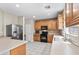 Bright kitchen with wood cabinets, stainless steel appliances, and plenty of counter space at 7818 Brodie Castle Ct, Las Vegas, NV 89166