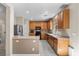 Functional kitchen with ample cabinets, stainless steel appliances, and breakfast bar at 7818 Brodie Castle Ct, Las Vegas, NV 89166