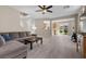 Open-concept living area featuring tiled floors, neutral paint, and access to the backyard at 7818 Brodie Castle Ct, Las Vegas, NV 89166