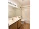 Neat bathroom features a single sink vanity, a large mirror, and a shower-tub combo at 7830 Foxwood Pl # 7830, Las Vegas, NV 89145