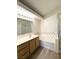 Bathroom featuring a bathtub and a walk-in shower at 7830 Foxwood Pl # 7830, Las Vegas, NV 89145