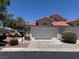 Charming one-story home with a two-car garage, a terra cotta roof, and well-maintained landscaping at 7830 Foxwood Pl # 7830, Las Vegas, NV 89145