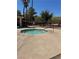 Community octagonal hot tub with concrete surround and metal safety railing at 7830 Foxwood Pl # 7830, Las Vegas, NV 89145