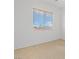 Neutral bedroom featuring tan carpeting and bright natural light from the window at 786 Craigmark Ct, Henderson, NV 89002