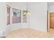 Bright dining area featuring a charming chandelier and inviting natural light at 786 Craigmark Ct, Henderson, NV 89002