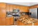 Beautiful kitchen featuring stainless steel appliances, granite countertops, and custom backsplash at 786 Craigmark Ct, Henderson, NV 89002