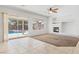 Open-concept living room with lots of natural light and view to backyard pool at 786 Craigmark Ct, Henderson, NV 89002