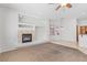 View of a light and airy living room complete with a fireplace and a window with natural light at 786 Craigmark Ct, Henderson, NV 89002