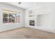 Bright living room showcasing a fireplace and view of the well-maintained backyard at 786 Craigmark Ct, Henderson, NV 89002