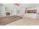 Spacious living room featuring a tiled floor and seamless access to the modern kitchen at 786 Craigmark Ct, Henderson, NV 89002
