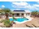 In-ground swimming pool with solar panels above at 786 Craigmark Ct, Henderson, NV 89002