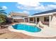 In-ground swimming pool and covered patio with solar panels above at 786 Craigmark Ct, Henderson, NV 89002