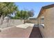Enclosed backyard with block wall, stone patio and low maintenance desert landscaping at 809 Greenbrook St, Las Vegas, NV 89110