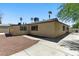 Rear view of a home with a well-kept yard and low-maintenance desert landscaping at 809 Greenbrook St, Las Vegas, NV 89110