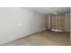 Unfinished basement with concrete flooring and large doors, providing ample space at 809 Greenbrook St, Las Vegas, NV 89110