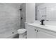 Modern bathroom showcasing a tiled shower, sleek vanity, and contemporary fixtures at 809 Greenbrook St, Las Vegas, NV 89110