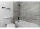 Classic bathroom features tiled shower, toilet, and tub at 809 Greenbrook St, Las Vegas, NV 89110
