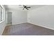 Spacious bedroom with carpeting, ceiling fan, and ensuite bathroom access for added convenience at 809 Greenbrook St, Las Vegas, NV 89110