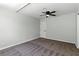 Neutral bedroom with a ceiling fan, carpet flooring, and white doors at 809 Greenbrook St, Las Vegas, NV 89110
