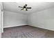 Neutral bedroom with a ceiling fan and carpet flooring at 809 Greenbrook St, Las Vegas, NV 89110