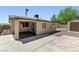 Charming single-story home with a covered patio and a secure gated entrance at 809 Greenbrook St, Las Vegas, NV 89110