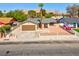 Charming single-story home boasting a low-maintenance desert landscape and gated front yard at 809 Greenbrook St, Las Vegas, NV 89110
