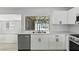 Close-up of the kitchen features sleek stainless steel appliances and a dual sink at 809 Greenbrook St, Las Vegas, NV 89110