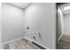 Spacious laundry room with new baseboards and flooring at 809 Greenbrook St, Las Vegas, NV 89110